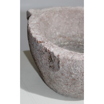 Pink stone holy water font