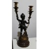 A pair of candlesticks depicting Cupids, signed L. GRÉGOIRE