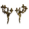 A pair of Louis XV-style bronze wall sconces