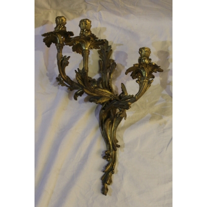 A pair of Louis XV-style bronze wall sconces