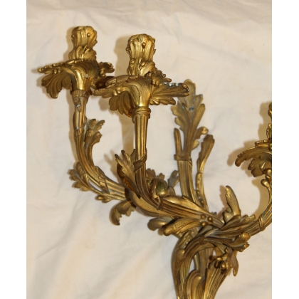 A pair of Louis XV-style bronze wall sconces