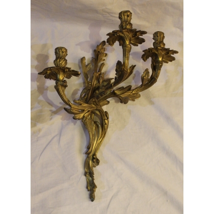 A pair of Louis XV-style bronze wall sconces