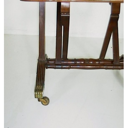 Mahogany door with engravings and brass castors
