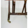 Mahogany door with engravings and brass castors