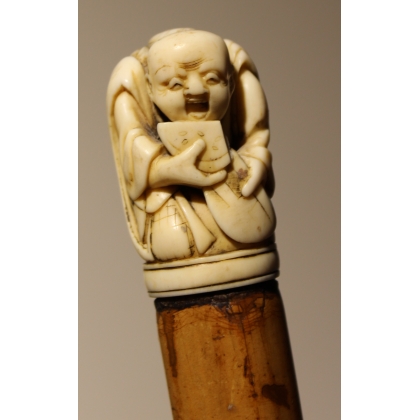 Canne avec pommeau "Netsuke", fût en jonc