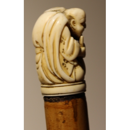 Canne avec pommeau "Netsuke", fût en jonc