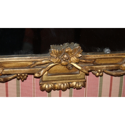 Espejo Luis XVI dorado. En  Moinat SA  - Antigüedades y decoración