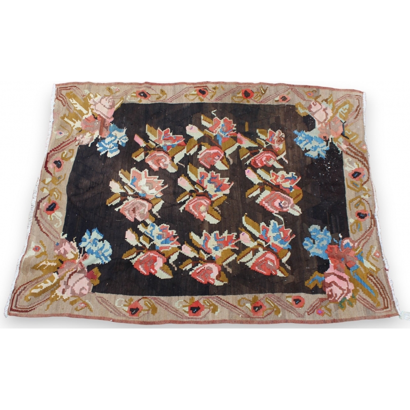 Kilim rug with a rose pattern on a black background