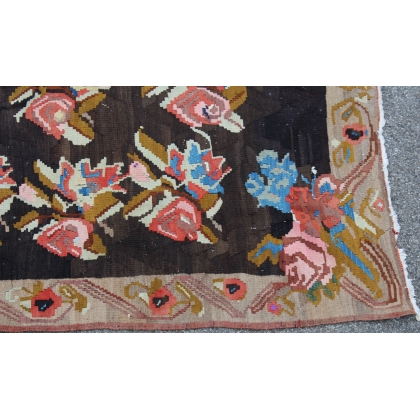 Kilim rug with a rose pattern on a black background