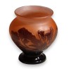 Purple bulb-shaped vase on a pink background, signed GALLÉ