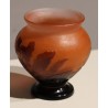 Purple bulb-shaped vase on a pink background, signed GALLÉ