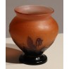 Purple bulb-shaped vase on a pink background, signed GALLÉ
