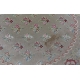 Tapis Arraiolos rond décor fleurs rose fond beige