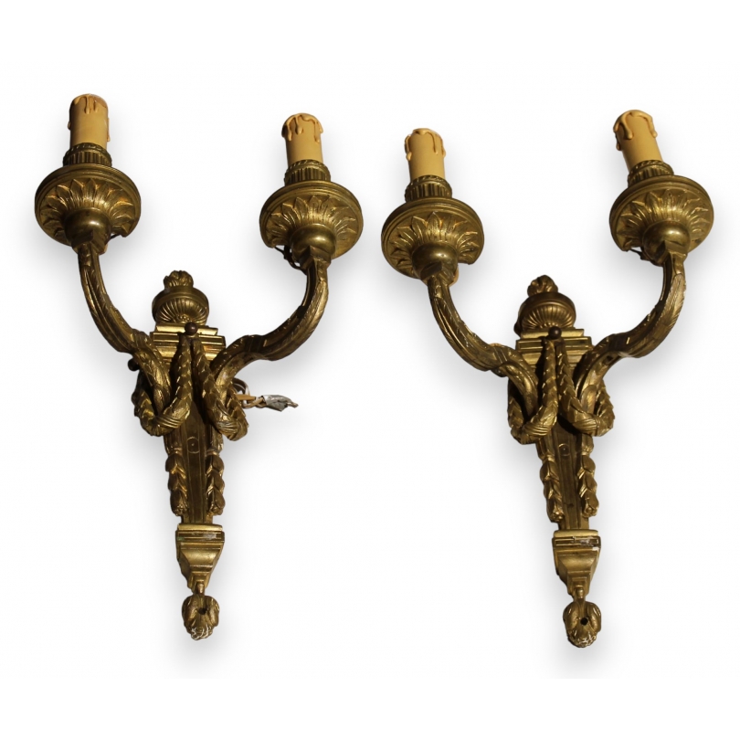 A pair of Louis XVI-style wall lights with two lights