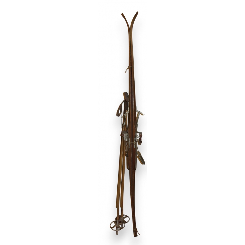 A pair of BADAN Kung Bore skis with poles