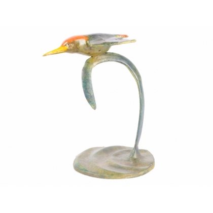 A kingfisher in flight, in polychrome bronze