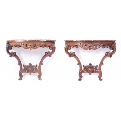 A pair of Regency-style side tables in carved oak