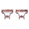 A pair of Regency-style side tables in carved oak