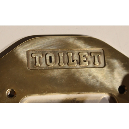 Polished brass toilet roll holder