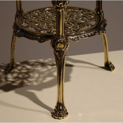 Round table with three polished brass tiers
