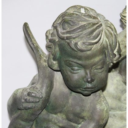 Pair of bronze putti on marble plinths