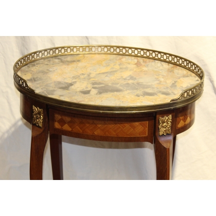 Oval Transition-style side table with a marble top