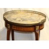 Oval Transition-style side table with a marble top