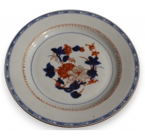 Assiette en porcelaine décor fleurs bleu et orange