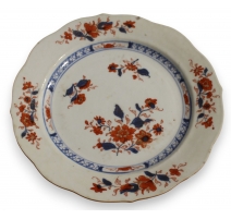Assiette en porcelaine décor fleurs bleu et orange