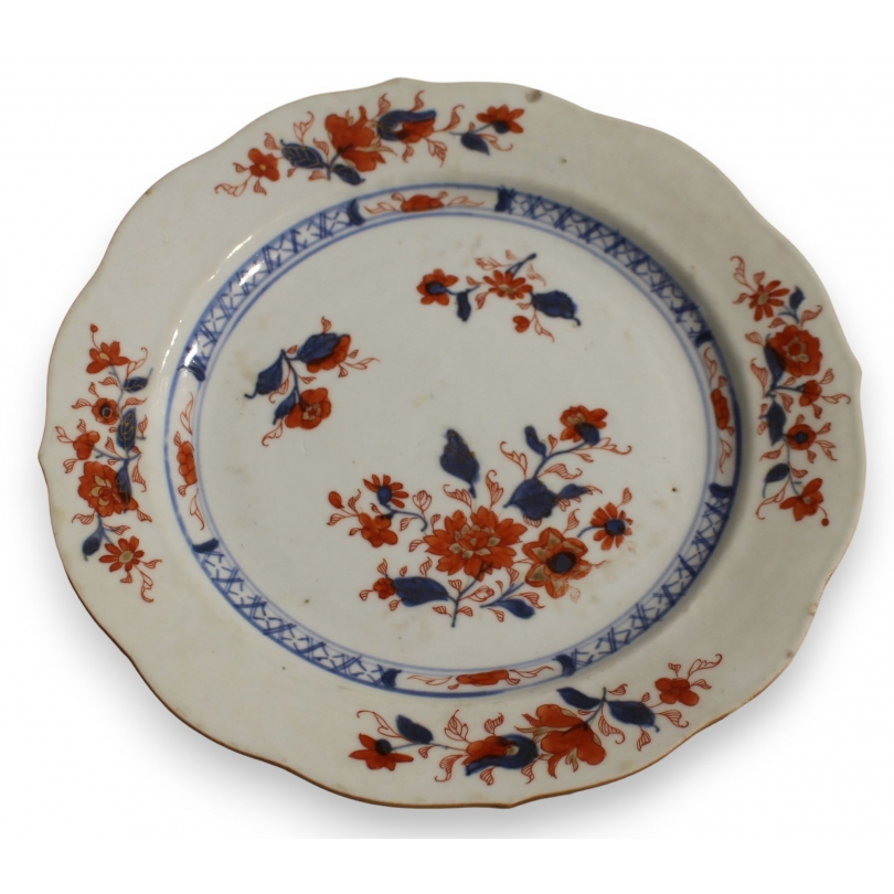 Assiette en porcelaine décor fleurs bleu et orange