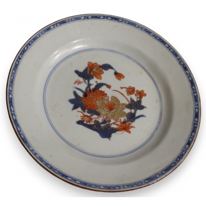 Assiette en porcelaine décor fleurs bleu et orange