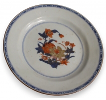 Assiette en porcelaine décor fleurs bleu et orange