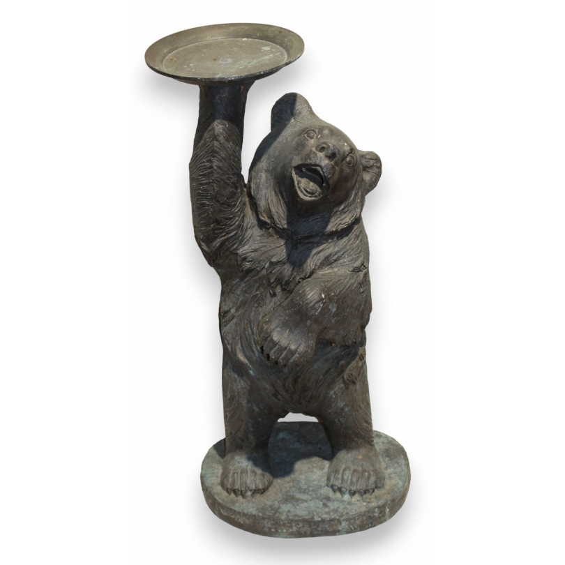 Bronze bear carrying a tray