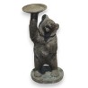 Bronze bear carrying a tray