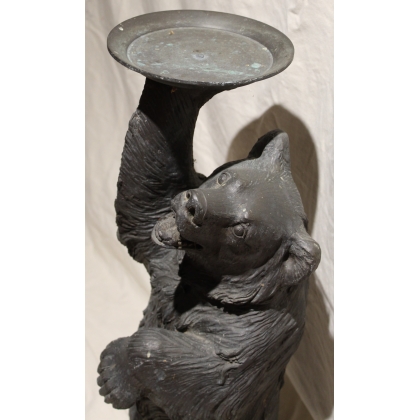 Bronze bear carrying a tray