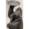 Bronze bear carrying a tray