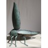 Bronze beetle with a green patina, shaped like a box