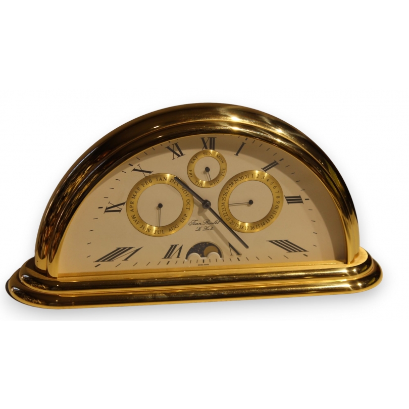 Rounded clock in gilded brass by Jean ROULET
