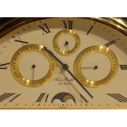 Rounded clock in gilded brass by Jean ROULET