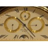 Rounded clock in gilded brass by Jean ROULET
