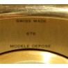 Rounded clock in gilded brass by Jean ROULET