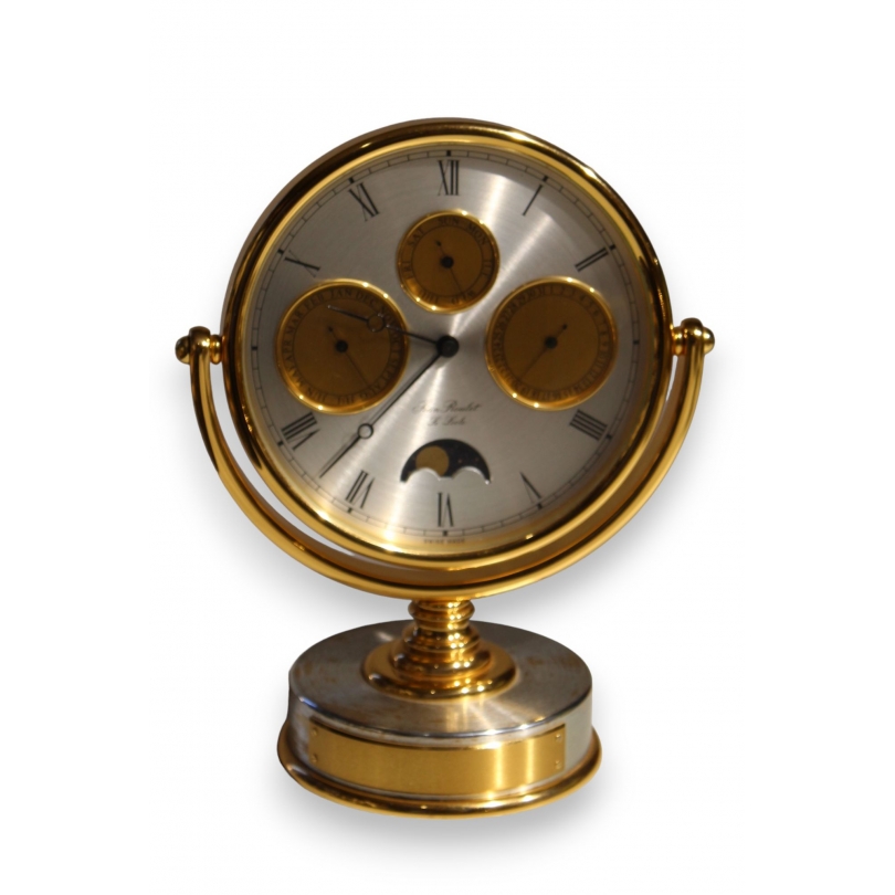 Circular clock in gilded brass by Jean ROULET