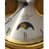 Circular clock in gilded brass by Jean ROULET