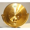 Circular clock in gilded brass by Jean ROULET