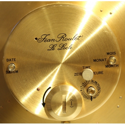 Circular clock in gilded brass by Jean ROULET