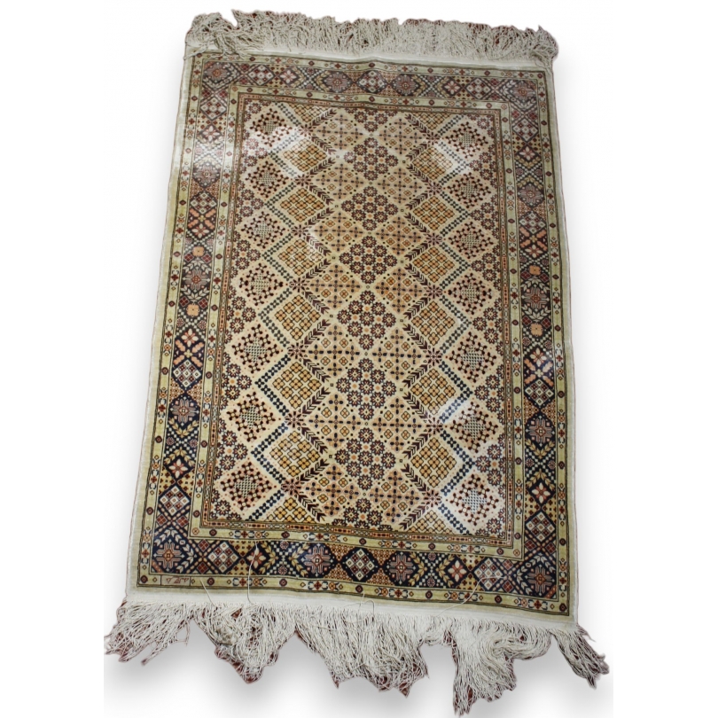Silk rugs, geometric patterns and flowers