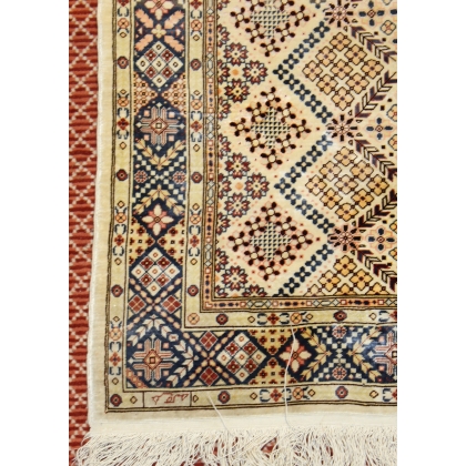 Silk rugs, geometric patterns and flowers