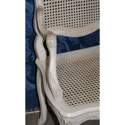 A pair of lacquered and cane-seated Regency armchairs. From  Moinat SA  - Antiques and home décor