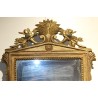 Miroir Empire, fronton sculpté de fleurs et gerbe