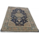 Tapis persan en laine fond bleu décor fleurs